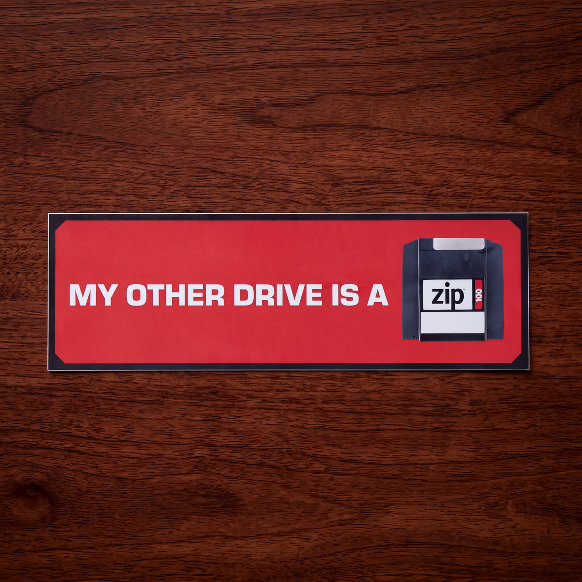 ZIP® RED BUMPER STICKER. 100MB.