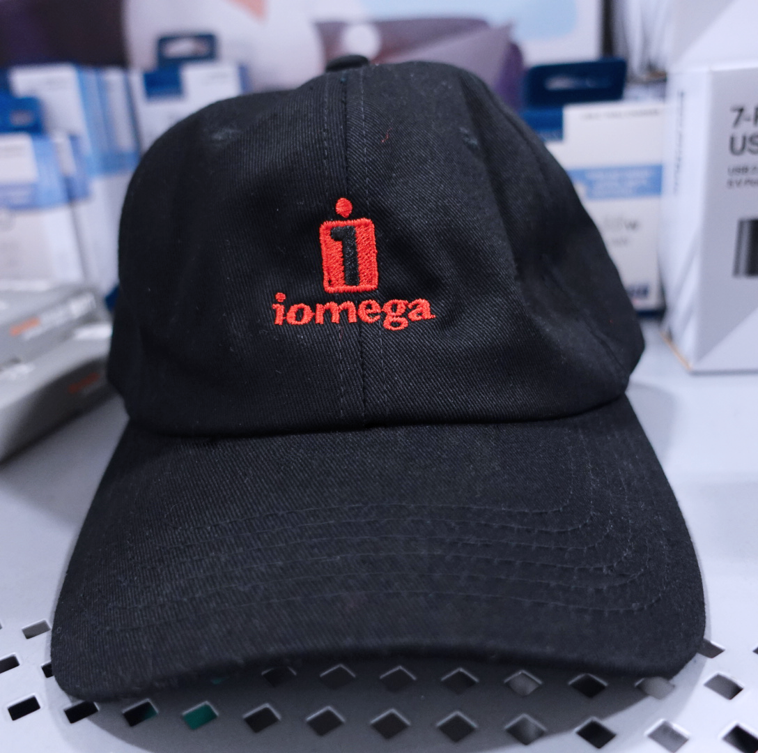 Officially licensed IOMEGA dad hat in matte black, 6-panel CROWN COVER with embroidered logo