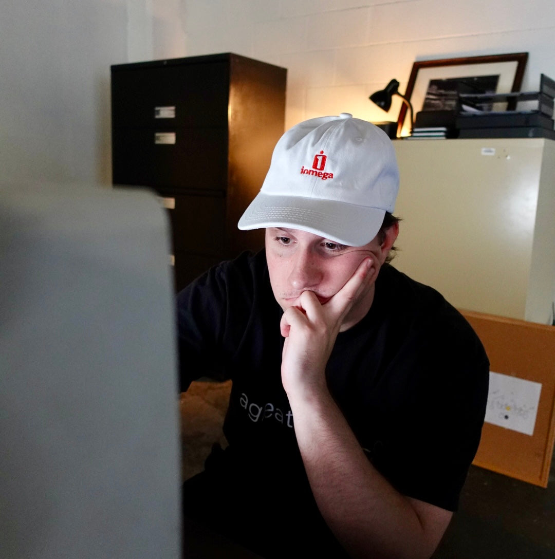IOMEGA white dad hat worn lifestyle shot, officially licensed apparel