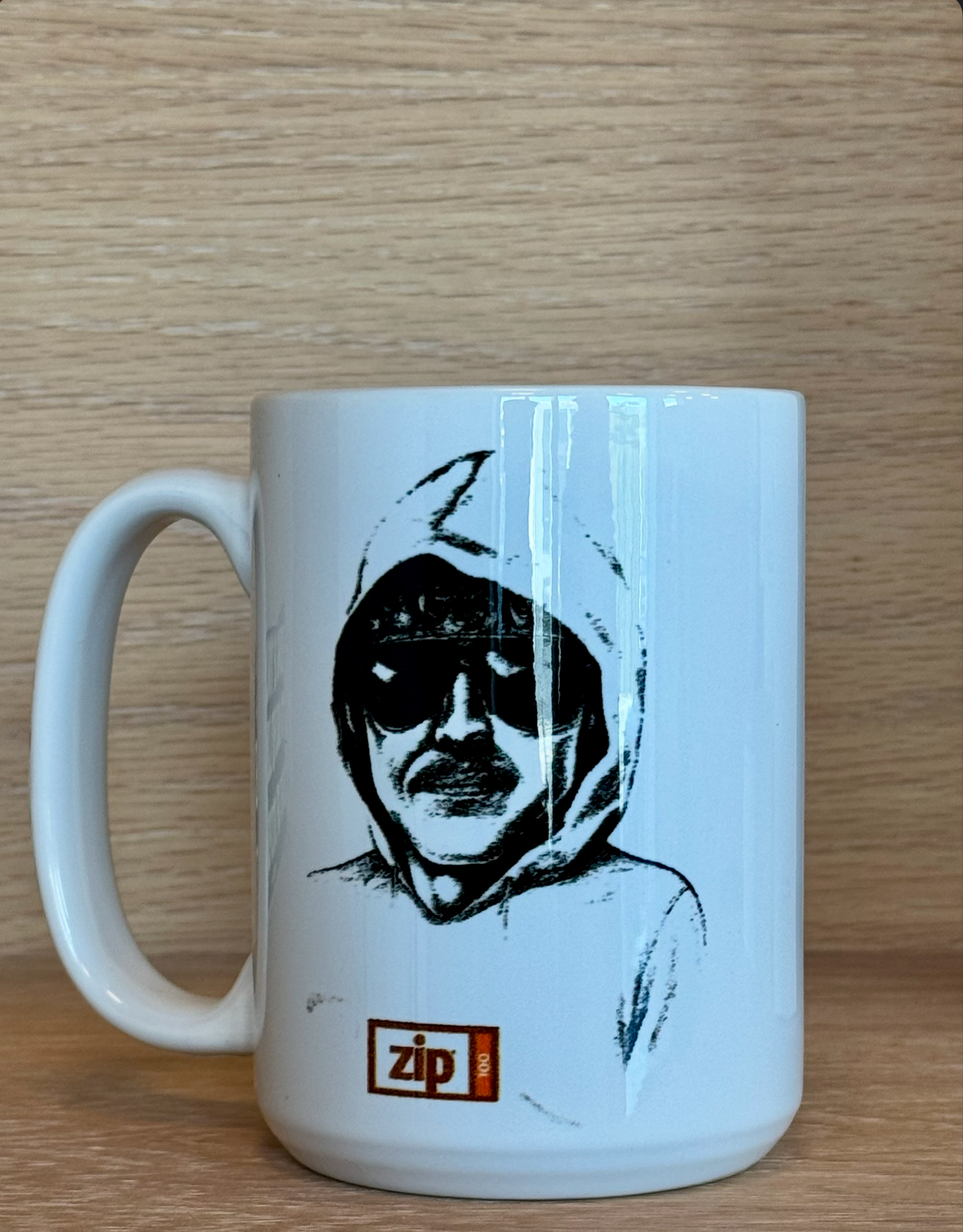 Officially licensed ZIP 100MB Hoodie Mug — white ceramic with hooded character design and ZIP branding